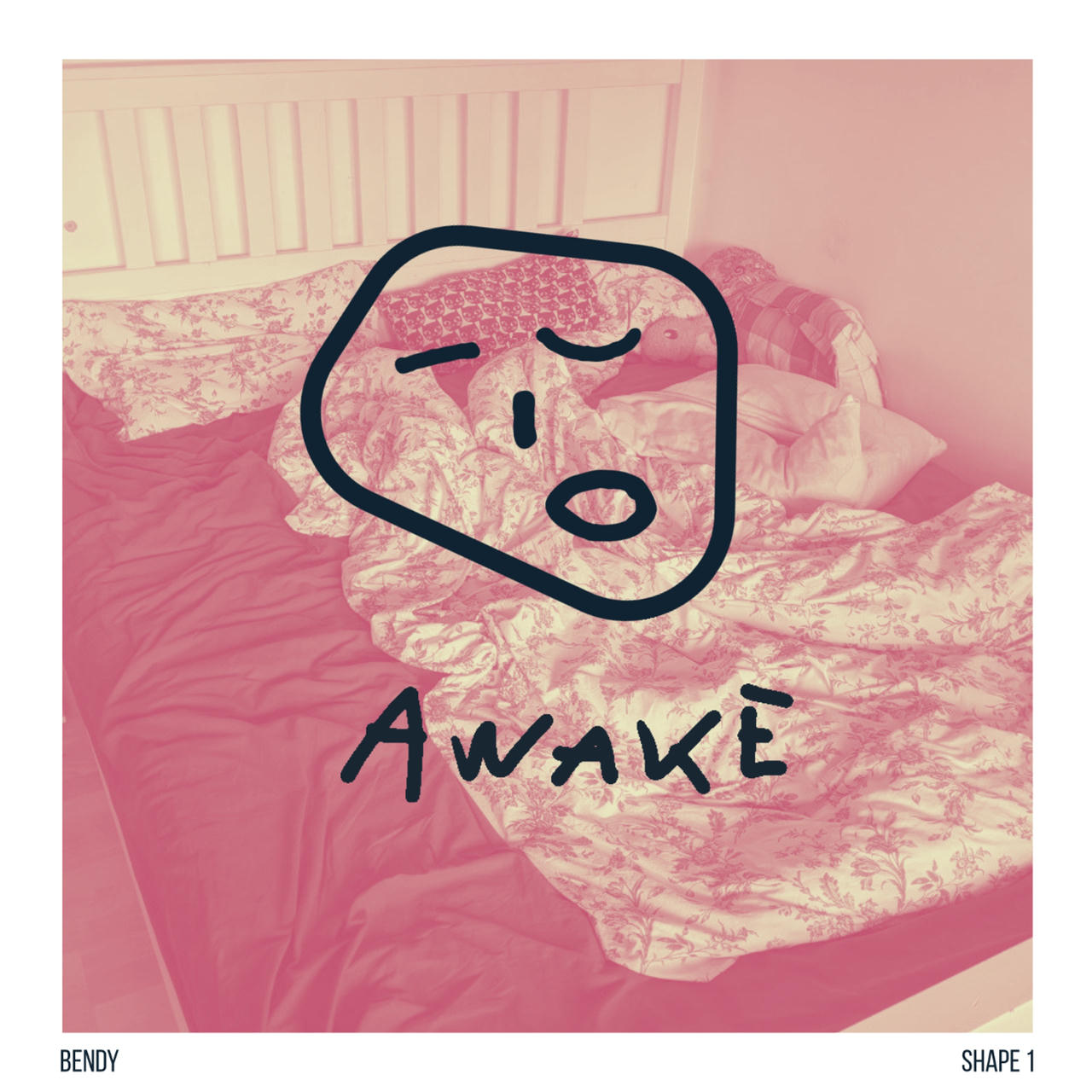 A simple geometric face shape that seems to be waking up on a pink background photo of a bed unmade